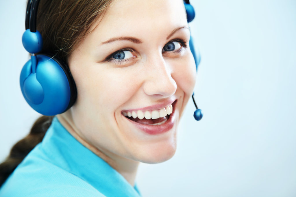 Portrait of smiling support phone operator in headset. customer service center